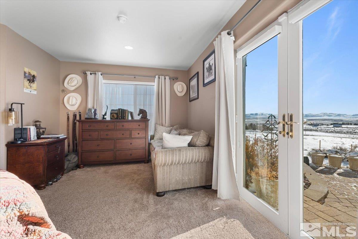 12803 North Red Rock Road Reno, NV 89508 - Photo 14 of 40 a living room with furniture and large windows
