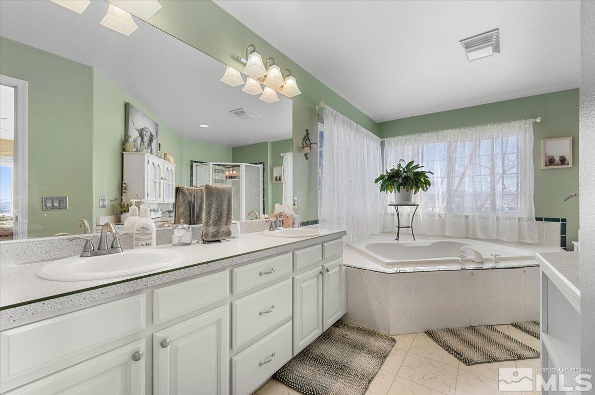 12803 North Red Rock Road Reno, NV 89508 - Photo 16 of 40 a bathroom with a double vanity sink mirror and