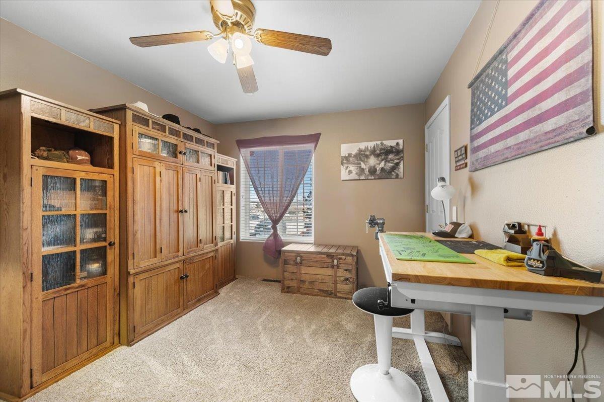 12803 North Red Rock Road Reno, NV 89508 - Photo 23 of 40 a bed room with furniture and a window