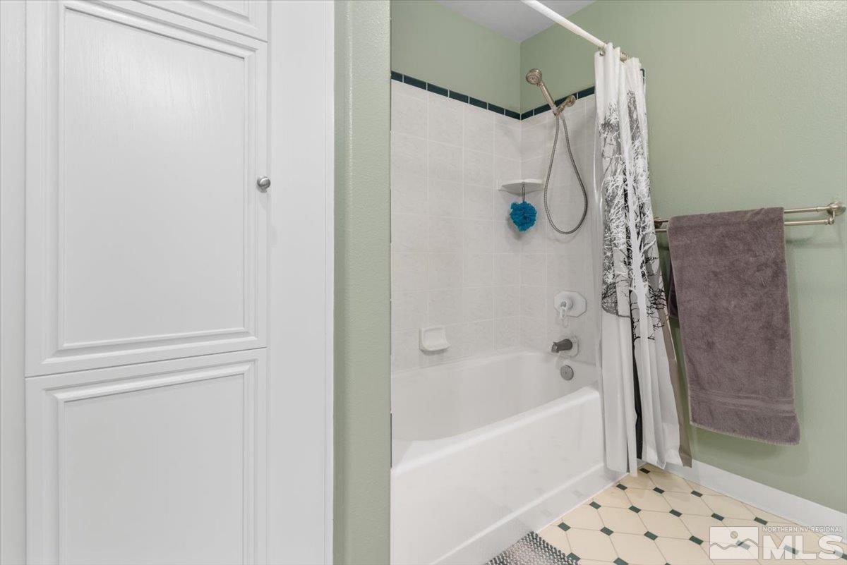 12803 North Red Rock Road Reno, NV 89508 - Photo 26 of 40 a bathroom with a bathtub and a shower