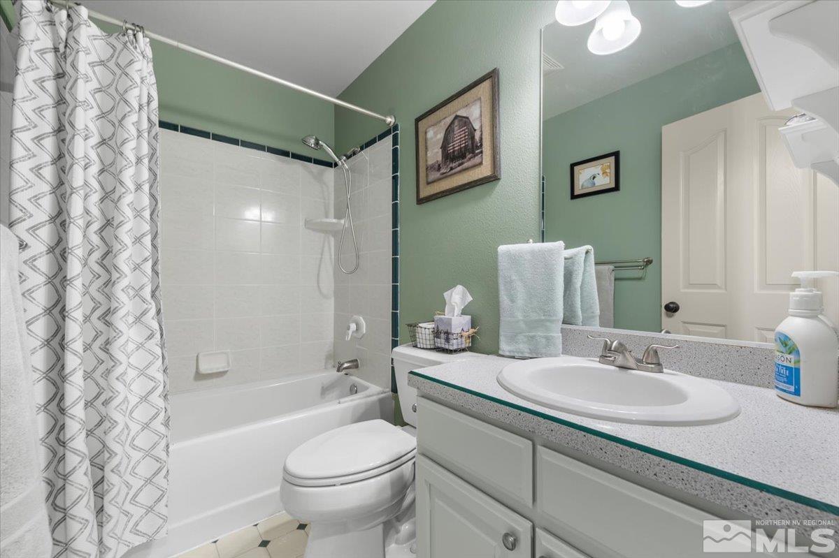 12803 North Red Rock Road Reno, NV 89508 - Photo 27 of 40 a bathroom with a granite countertop sink toilet and shower