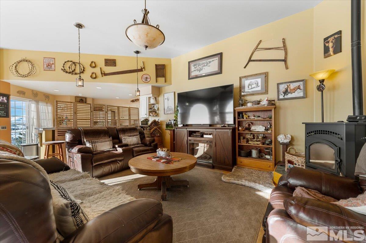12803 North Red Rock Road Reno, NV 89508 - Photo 5 of 40 a living room with furniture and a flat screen tv