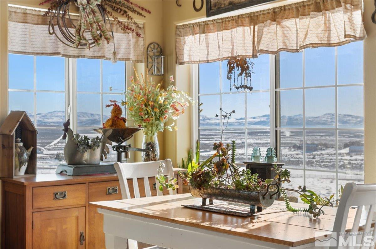 12803 North Red Rock Road Reno, NV 89508 - Photo 7 of 40 a table with a vase and flowers on it