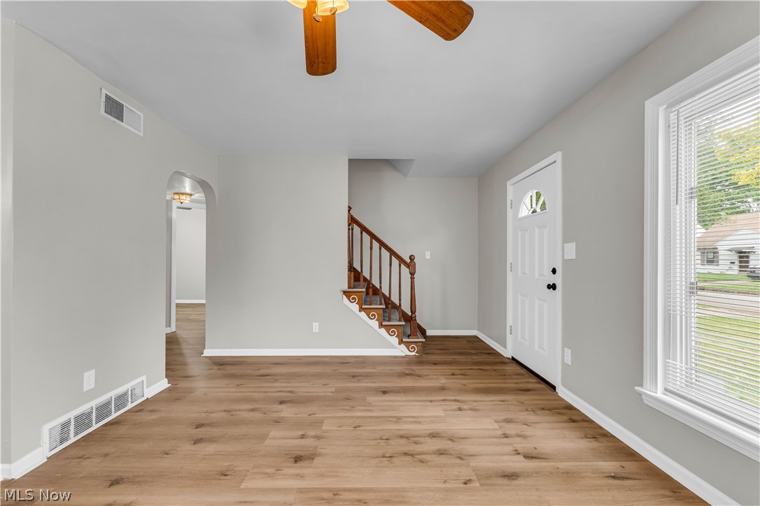 18517 Homeway Road Cleveland, OH 44135 - Photo 4 of 29 Living area featuring wood-finish flooring and light gray walls