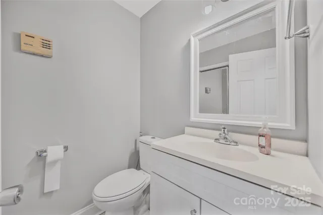 a view of a hallway with wooden floor and entryway