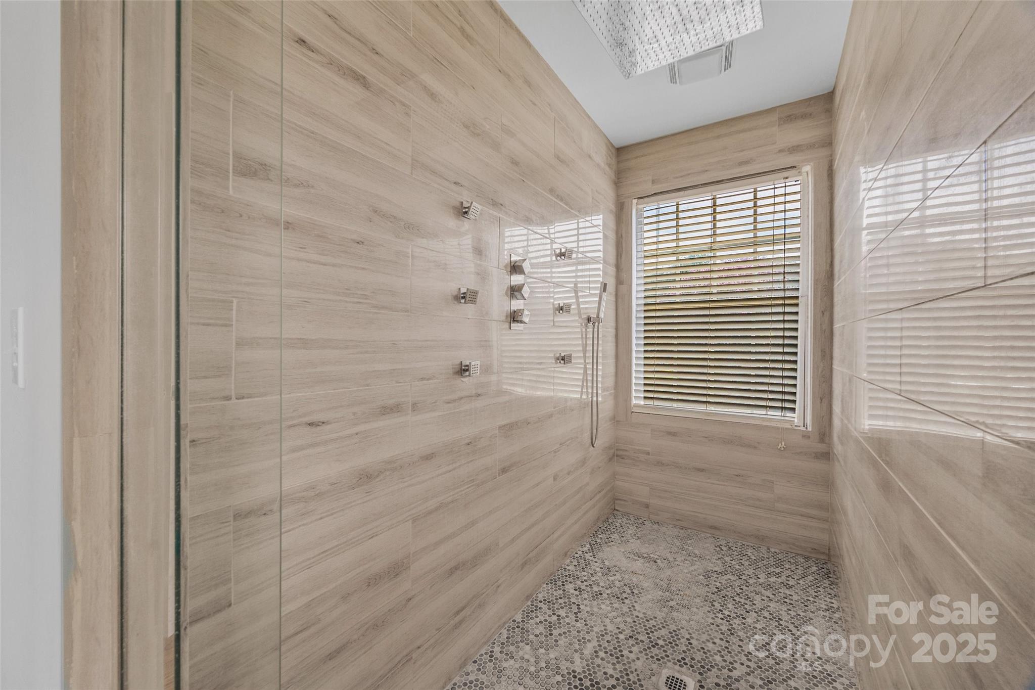 12662 Woodside Falls Road Pineville, NC 28134 - Photo 27 of 47 a bathroom with a shower