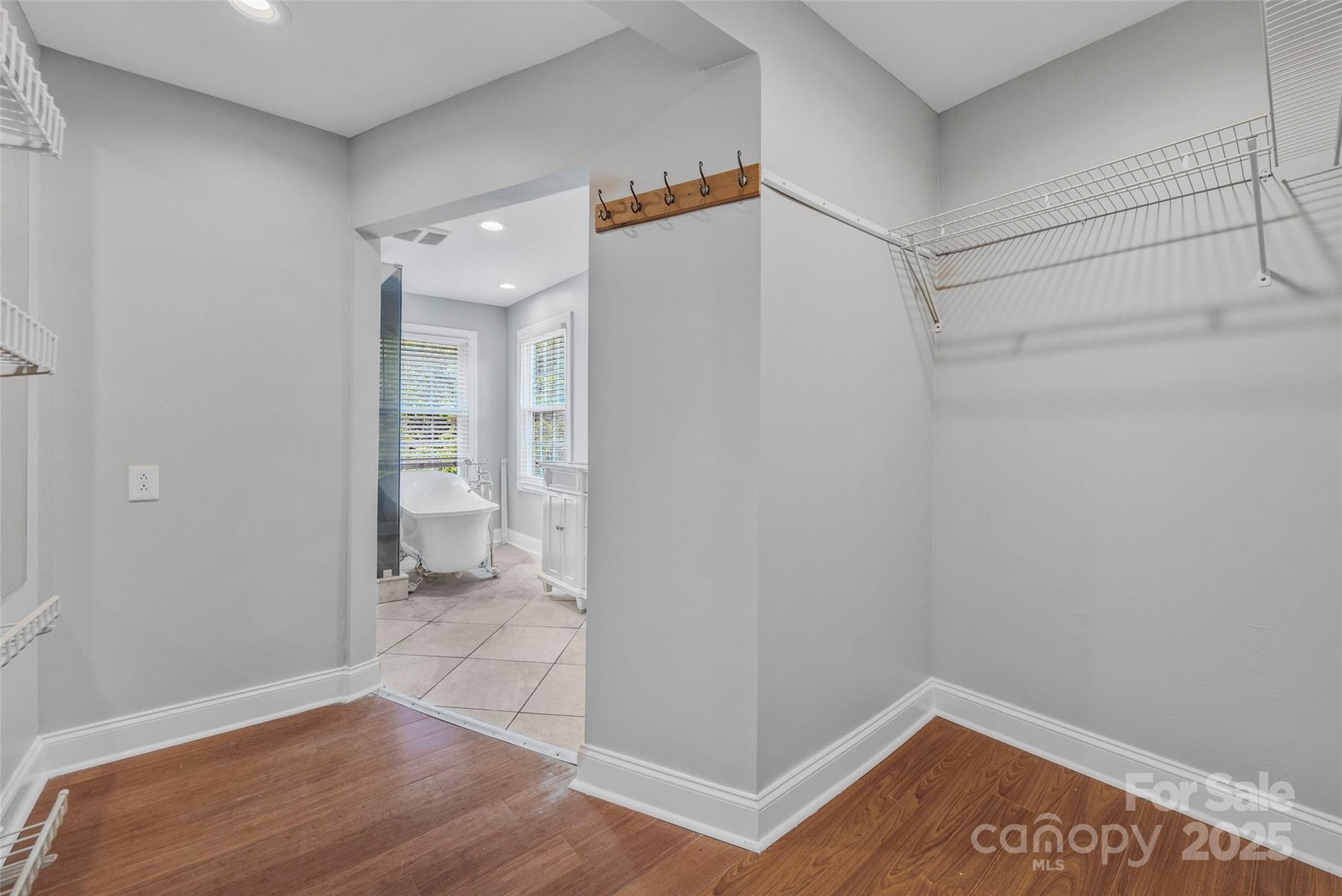 12662 Woodside Falls Road Pineville, NC 28134 - Photo 32 of 47 a view of a room with wooden floor and bathroom view