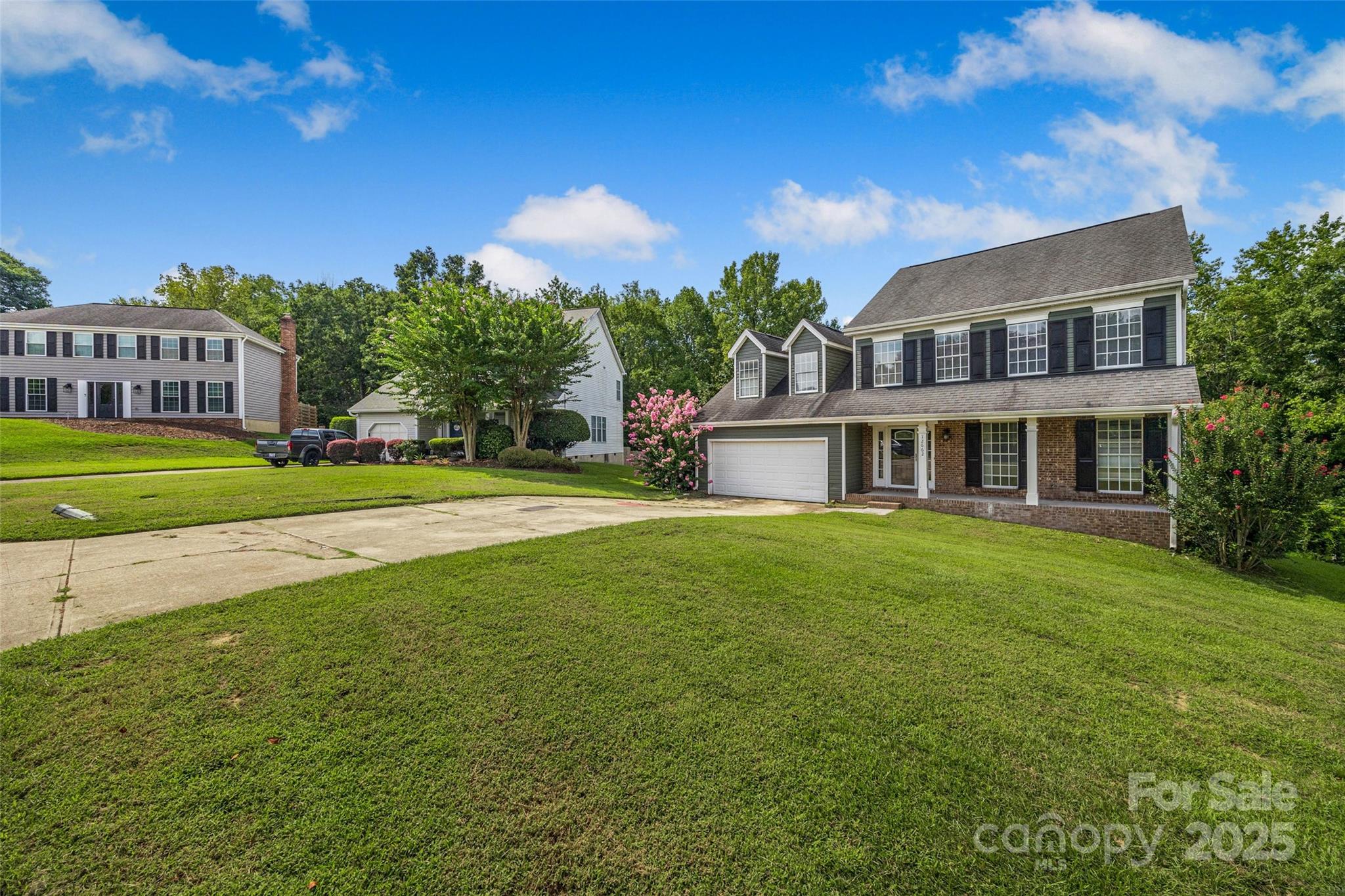 12662 Woodside Falls Road Pineville, NC 28134 - Photo 39 of 47 a front view of a building with a garden