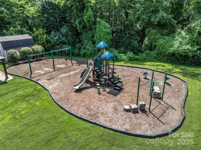 an aerial view of a house with lake view