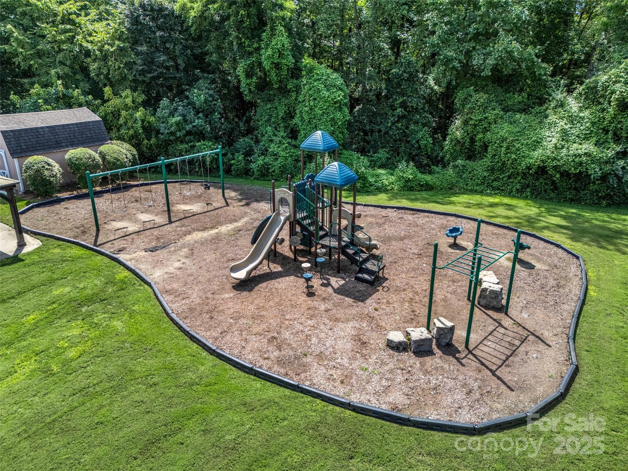 12662 Woodside Falls Road Pineville, NC 28134 - Photo 44 of 47 a view of a swimming pool with a patio