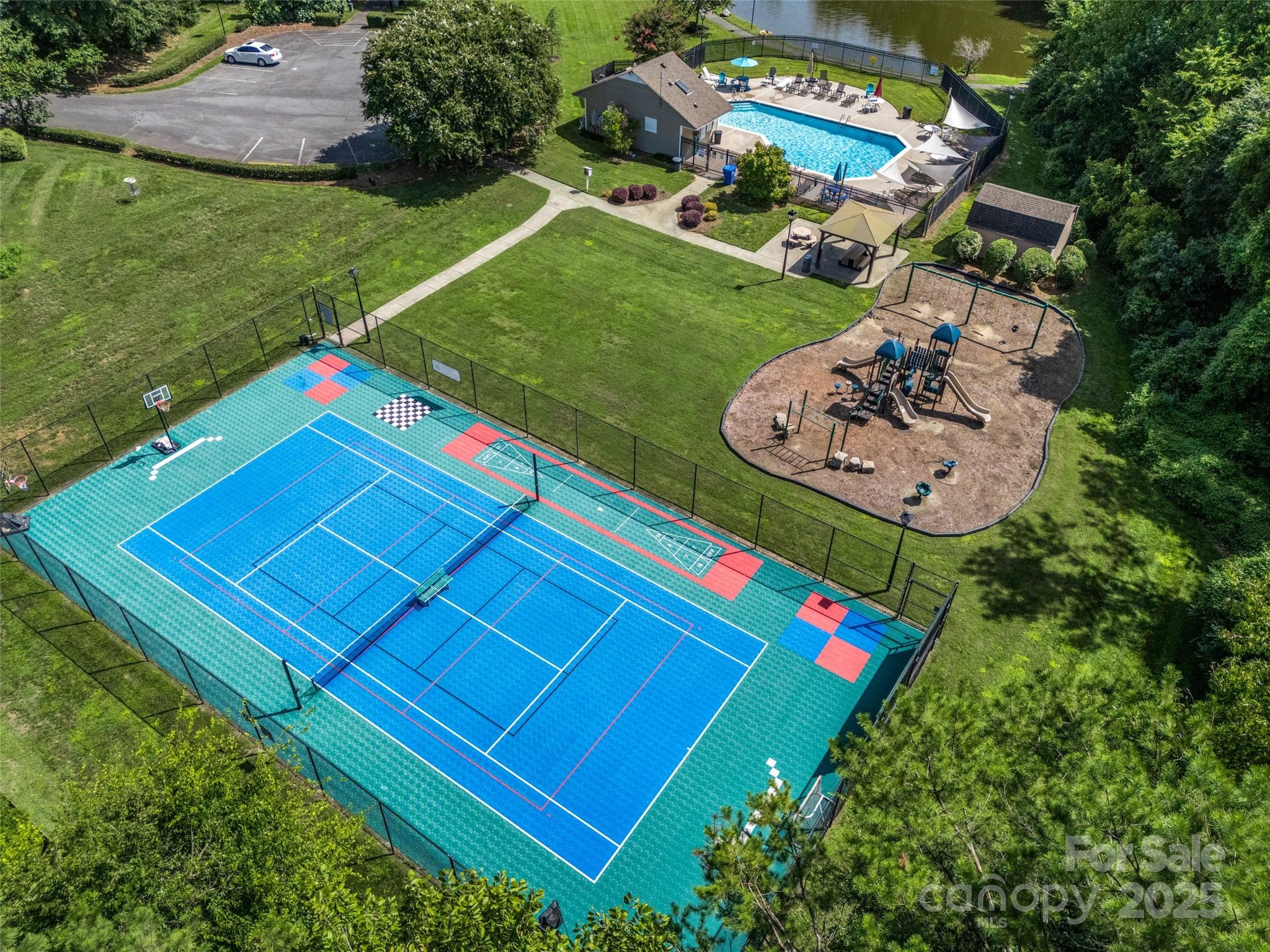 12662 Woodside Falls Road Pineville, NC 28134 - Photo 47 of 47 an aerial view of a pool yard and outdoor seating