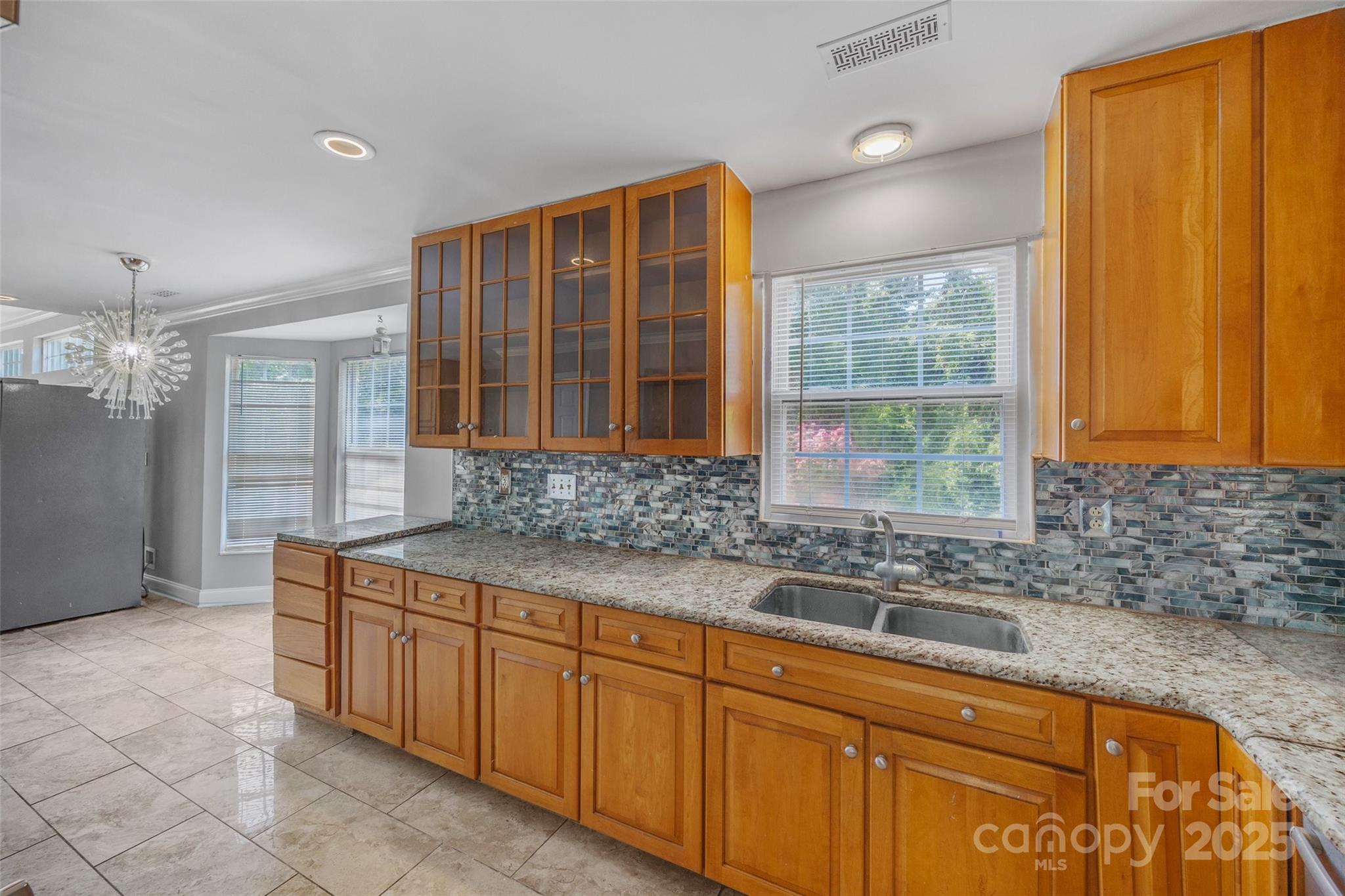 12662 Woodside Falls Road Pineville, NC 28134 - Photo 7 of 47 a bathroom with a granite countertop sink and a mirror
