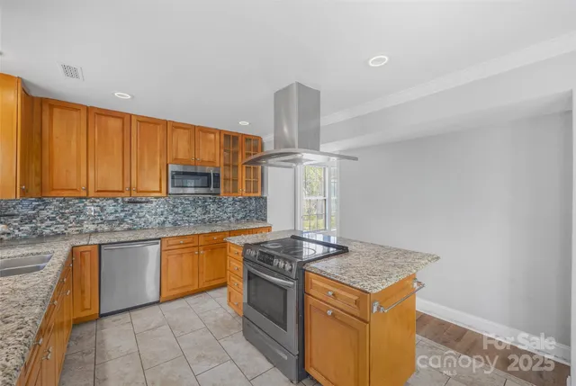 a kitchen with a stove and a sink