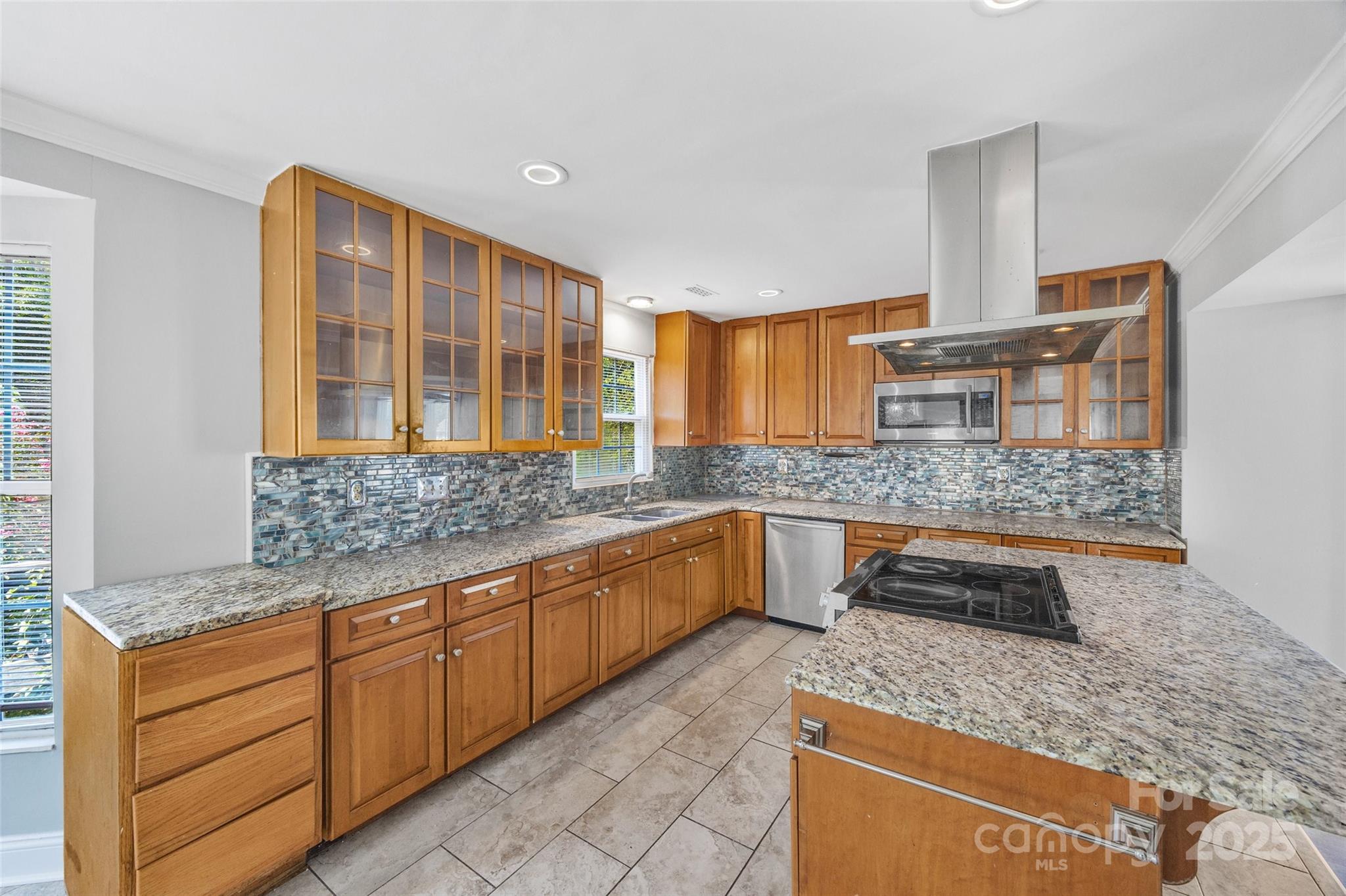 12662 Woodside Falls Road Pineville, NC 28134 - Photo 10 of 47 a kitchen with stainless steel appliances granite countertop a sink and a granite counter tops