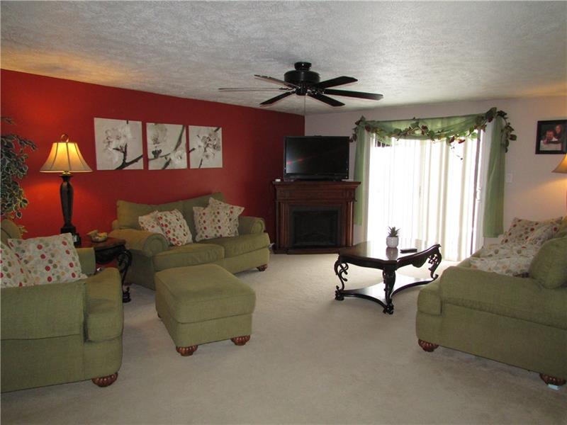 Living room with walk out patio doors to rear deck and gazebo.