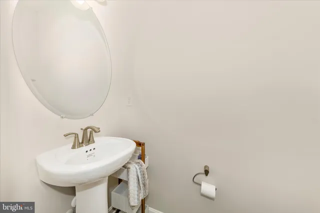 a bathroom with a sink a mirror and vanity