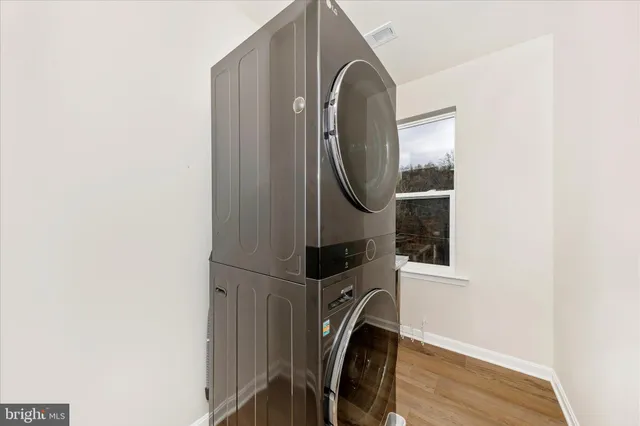 a view of a hallway with washer and dryer
