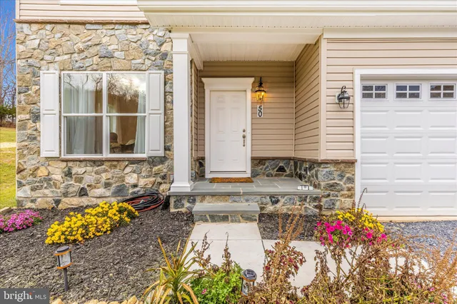 a bathroom with a tub and a large window