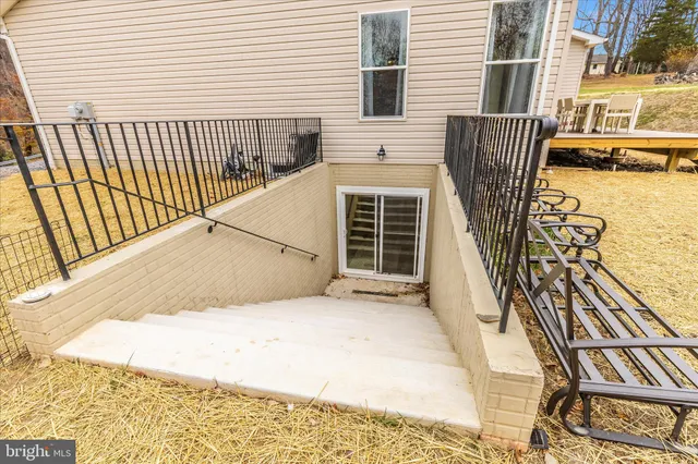 a view of a balcony with a floor to ceiling window next to a road