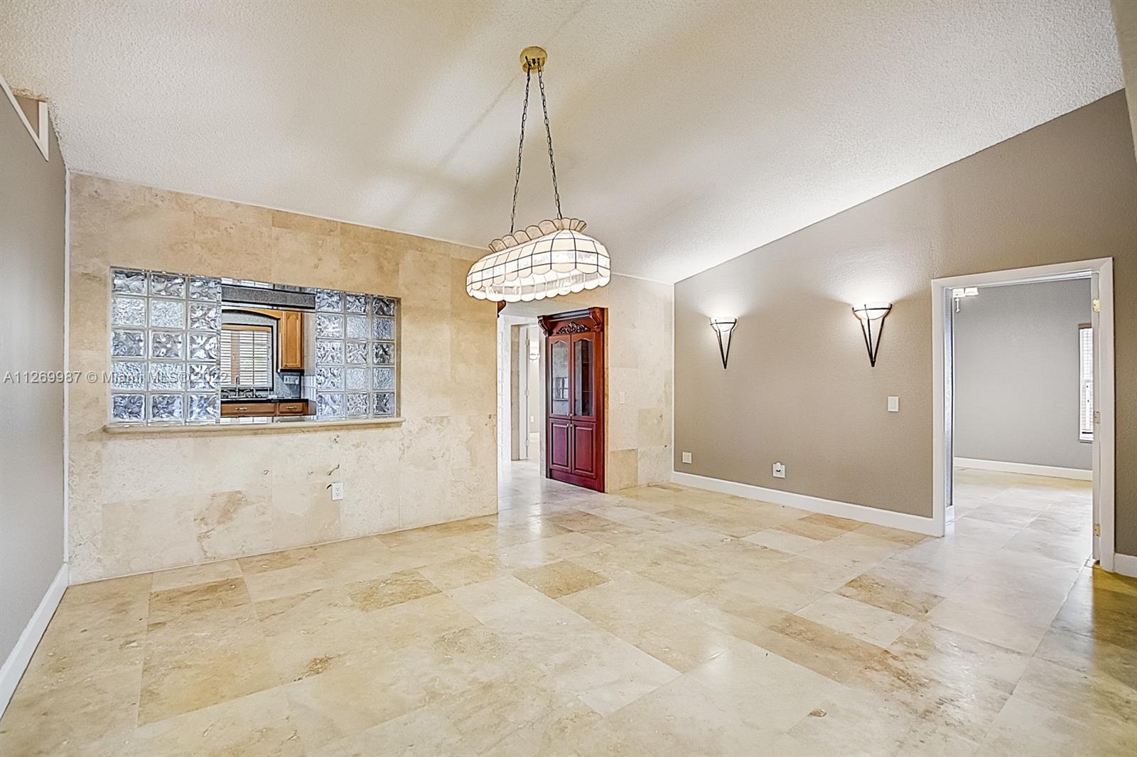 15540 Southwest 156th Avenue Miami, FL 33187 - Photo 26 of 37 a view of a room with window and a chandelier