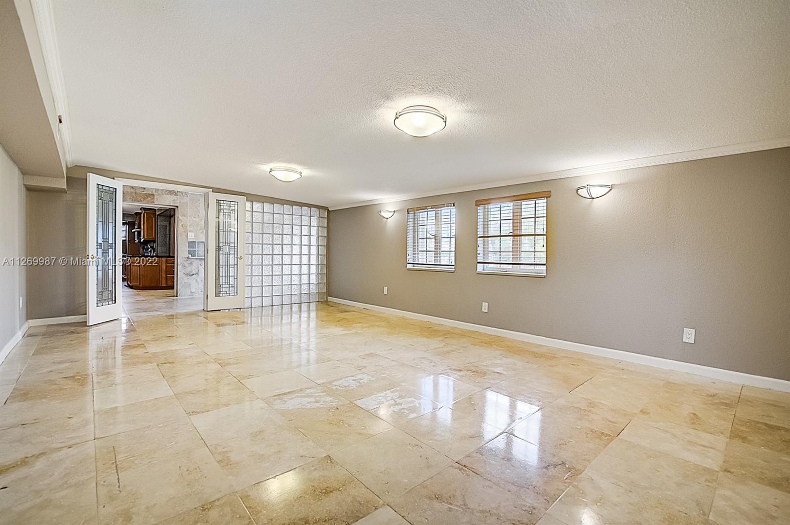 15540 Southwest 156th Avenue Miami, FL 33187 - Photo 6 of 37 a view of an empty room with a window