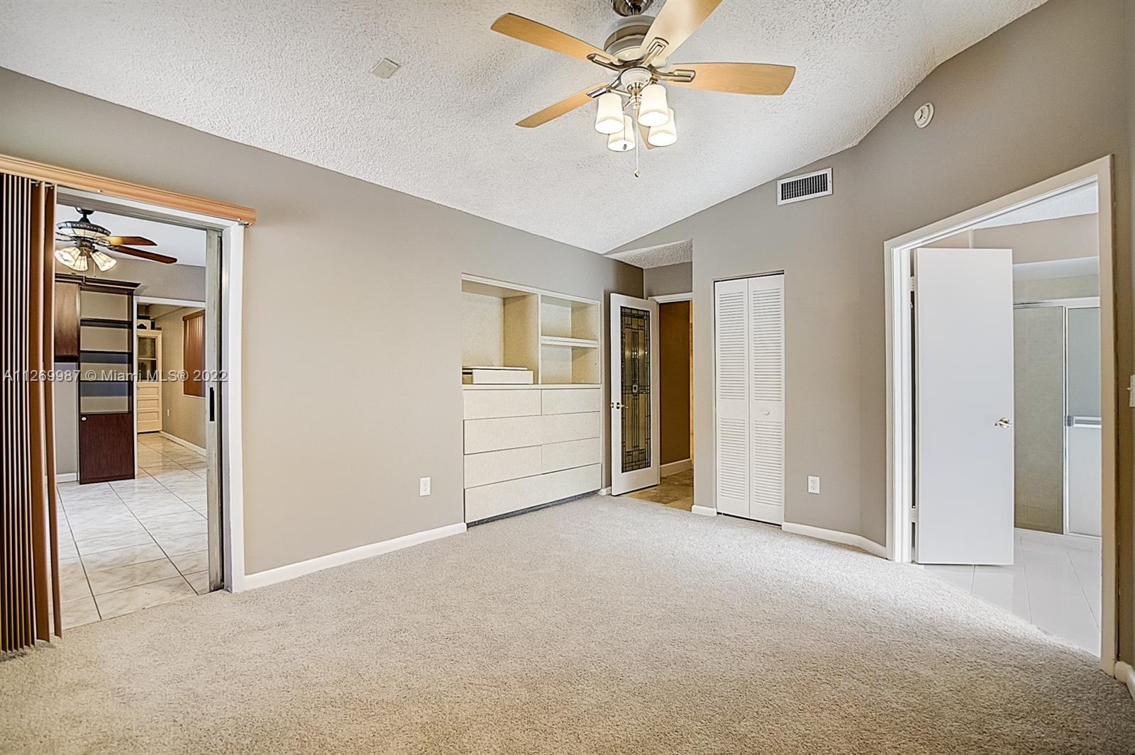15540 Southwest 156th Avenue Miami, FL 33187 - Photo 7 of 37 a view of an empty room with a bathroom