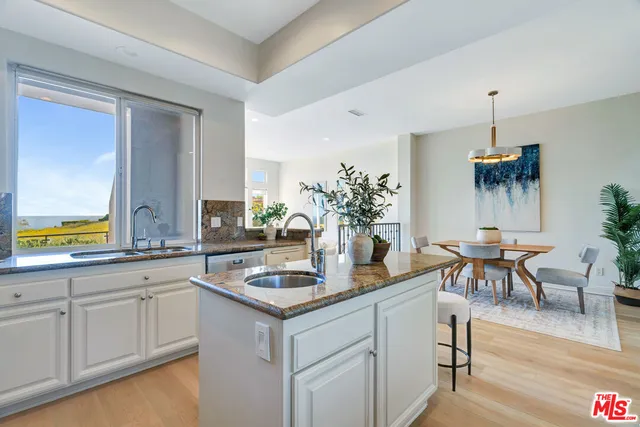 a kitchen with a table and chairs in it