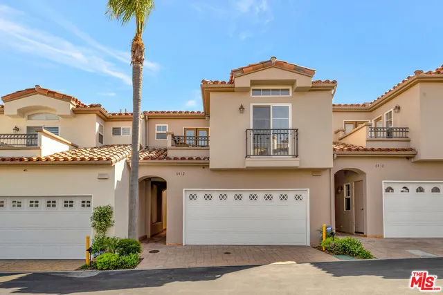 a front view of a building with garden