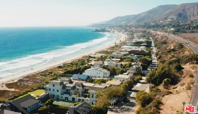 a view of a swimming pool with outdoor seating