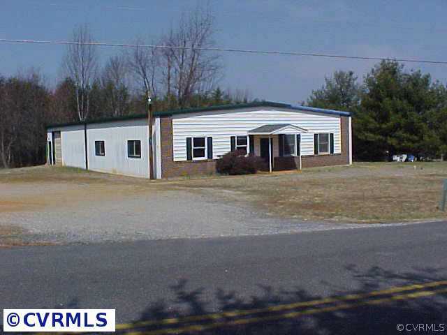 659 Fairgrounds Road Farmville, VA 23901 - Photo 2 of 4 a front view of a house with a yard and trees