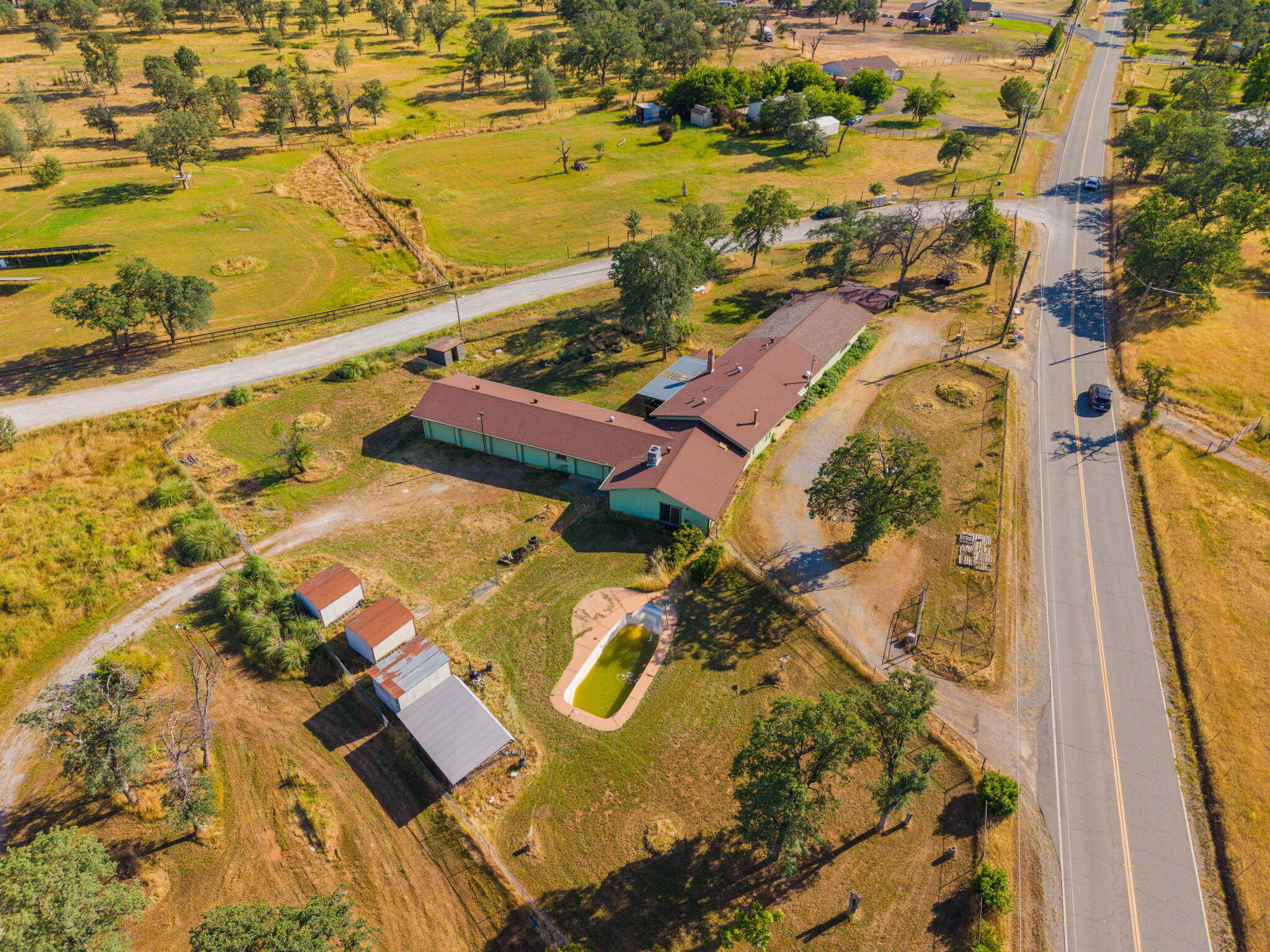 22189 Old Alturas Road Redding, CA 96003 - Photo 59 of 70 an aerial view of residential houses with outdoor space
