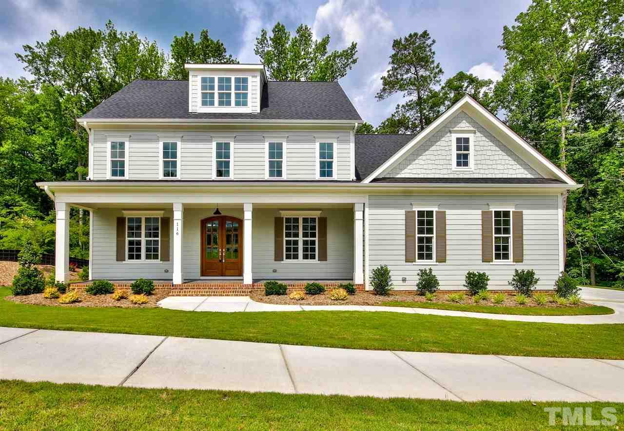 116 Roseroot Court Holly Springs, NC 27540 - Photo 1 of 25 Winning curb appeal with crisp farmhouse-inspired styling complete with wide rocking chair front porch.