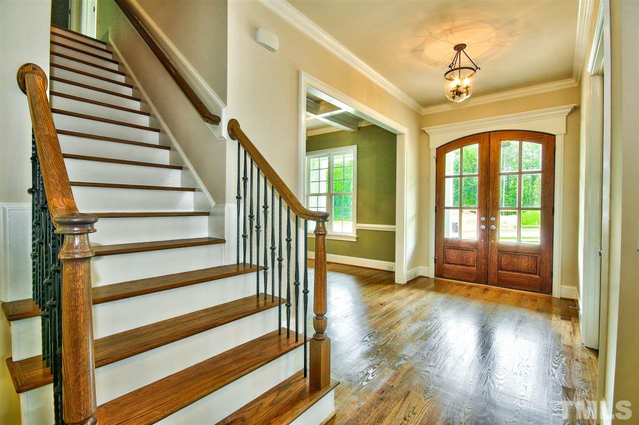 116 Roseroot Court Holly Springs, NC 27540 - Photo 2 of 25 Gently arched double doors open to welcoming foyer flanked by the Dining Room and Study!