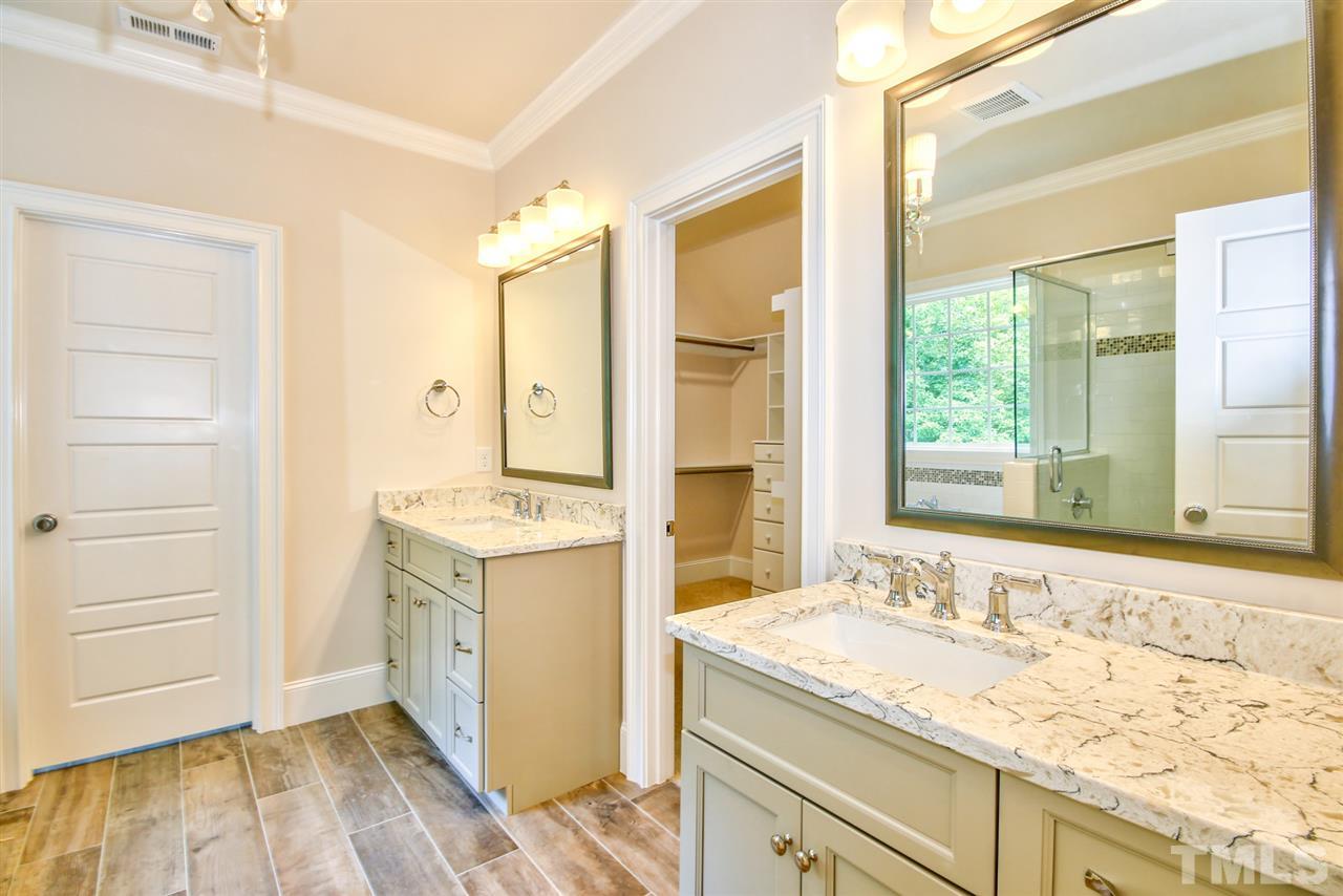 116 Roseroot Court Holly Springs, NC 27540 - Photo 13 of 25 Split vanities in the Master Bath drenched in vogue finishes.