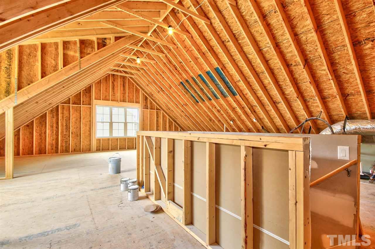 116 Roseroot Court Holly Springs, NC 27540 - Photo 16 of 25 Unfinished walk-up attic ideal for storage!