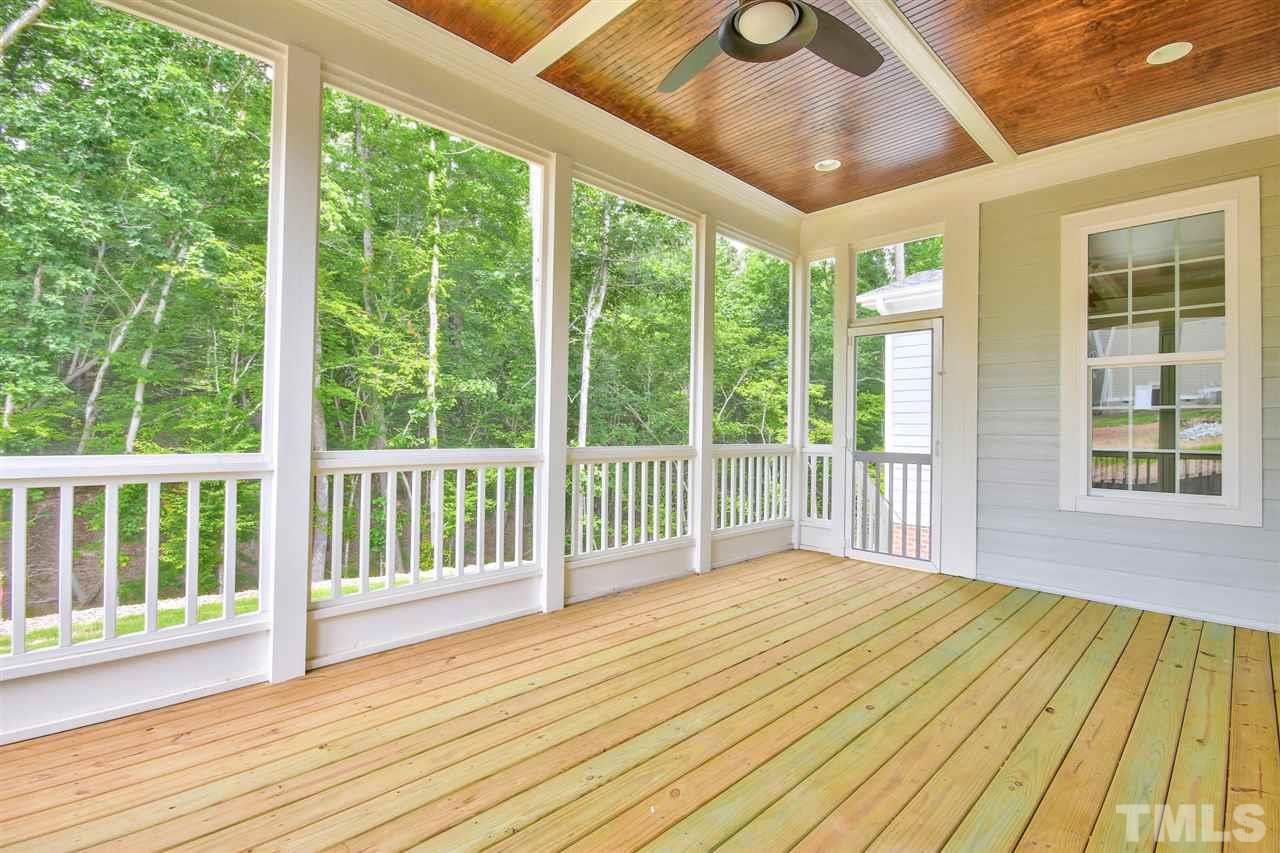 116 Roseroot Court Holly Springs, NC 27540 - Photo 17 of 25 Well proportioned Screen Porch with stained beadboard ceiling.