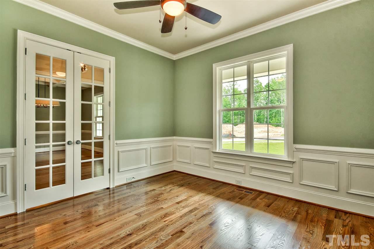 116 Roseroot Court Holly Springs, NC 27540 - Photo 4 of 25 Study with French doors off the Foyer makes a wonderful home office space.