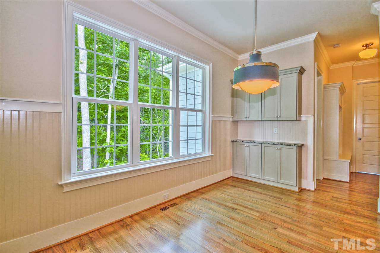 116 Roseroot Court Holly Springs, NC 27540 - Photo 7 of 25 The sunny Breakfast Room is the perfect spot to start your day. Built-ins line side wall for additional china storage/serving area.