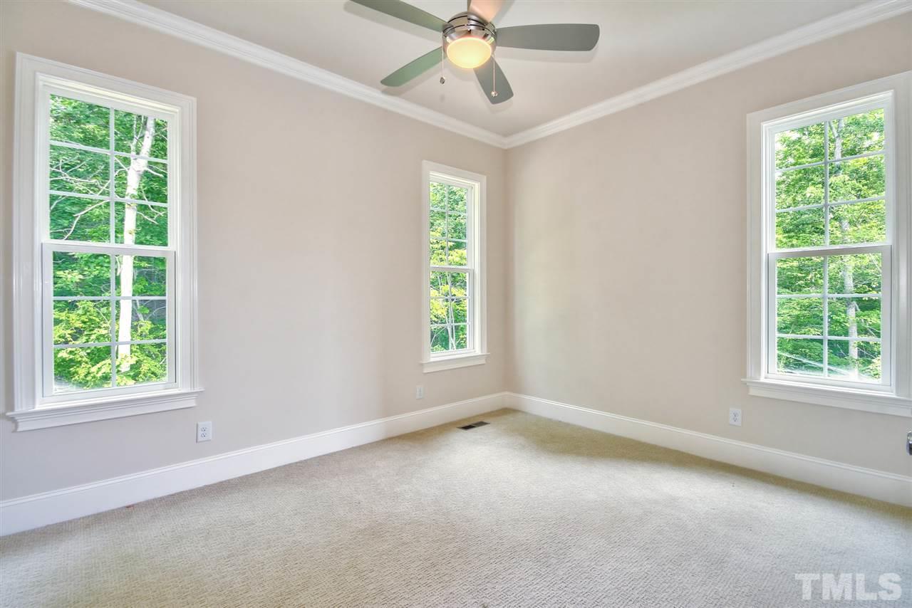 116 Roseroot Court Holly Springs, NC 27540 - Photo 9 of 25 Main Floor Guest with direct bath access is tucked away at the rear of home for added privacy.