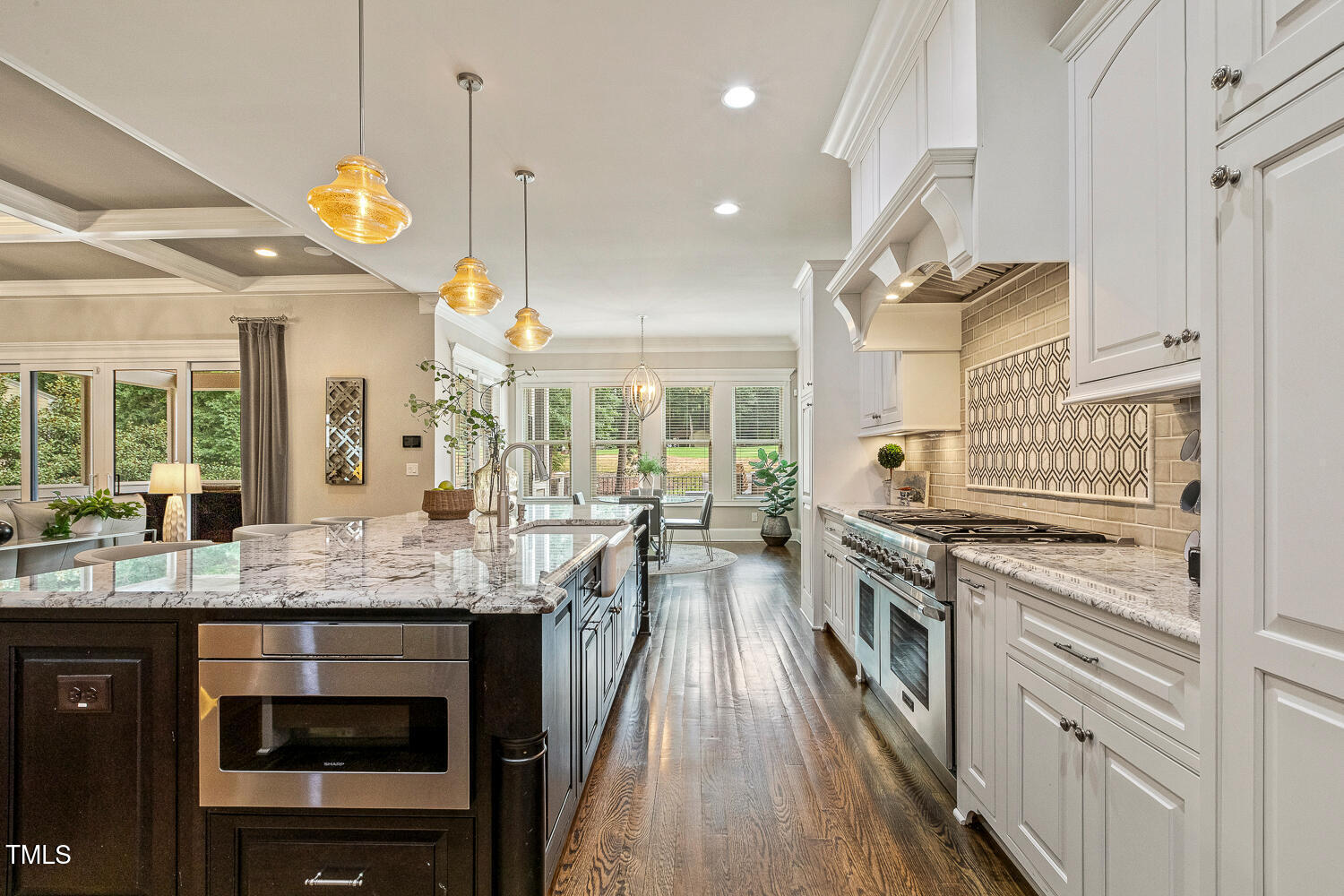 1205 Queensferry Road Cary, NC 27511 - Photo 11 of 63 a kitchen with stainless steel appliances granite countertop a stove a sink and a refrigerator