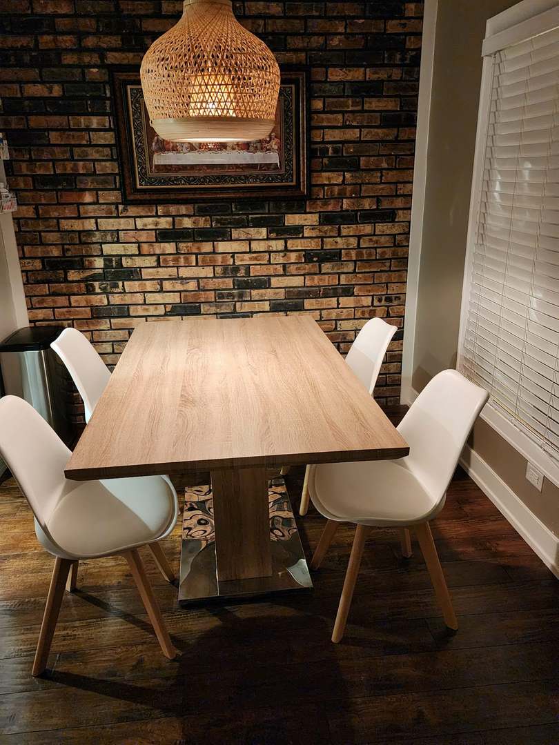 9830 Sayre Avenue, Unit 13 Chicago Ridge, IL 60415 - Photo 15 of 34 a view of a chairs and table in back of kitchen