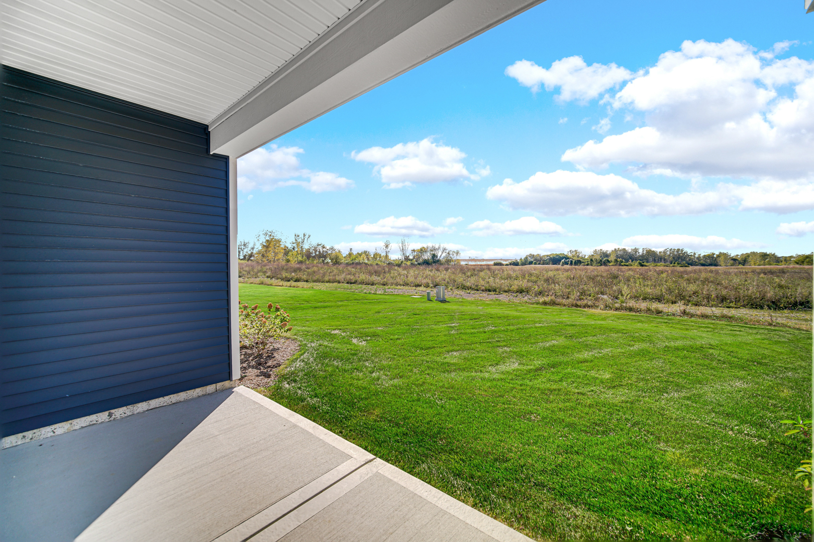 2930 Harnish Drive Algonquin, IL 60102 - Photo 22 of 32 a view of a pathway both side of grassy field with shrub