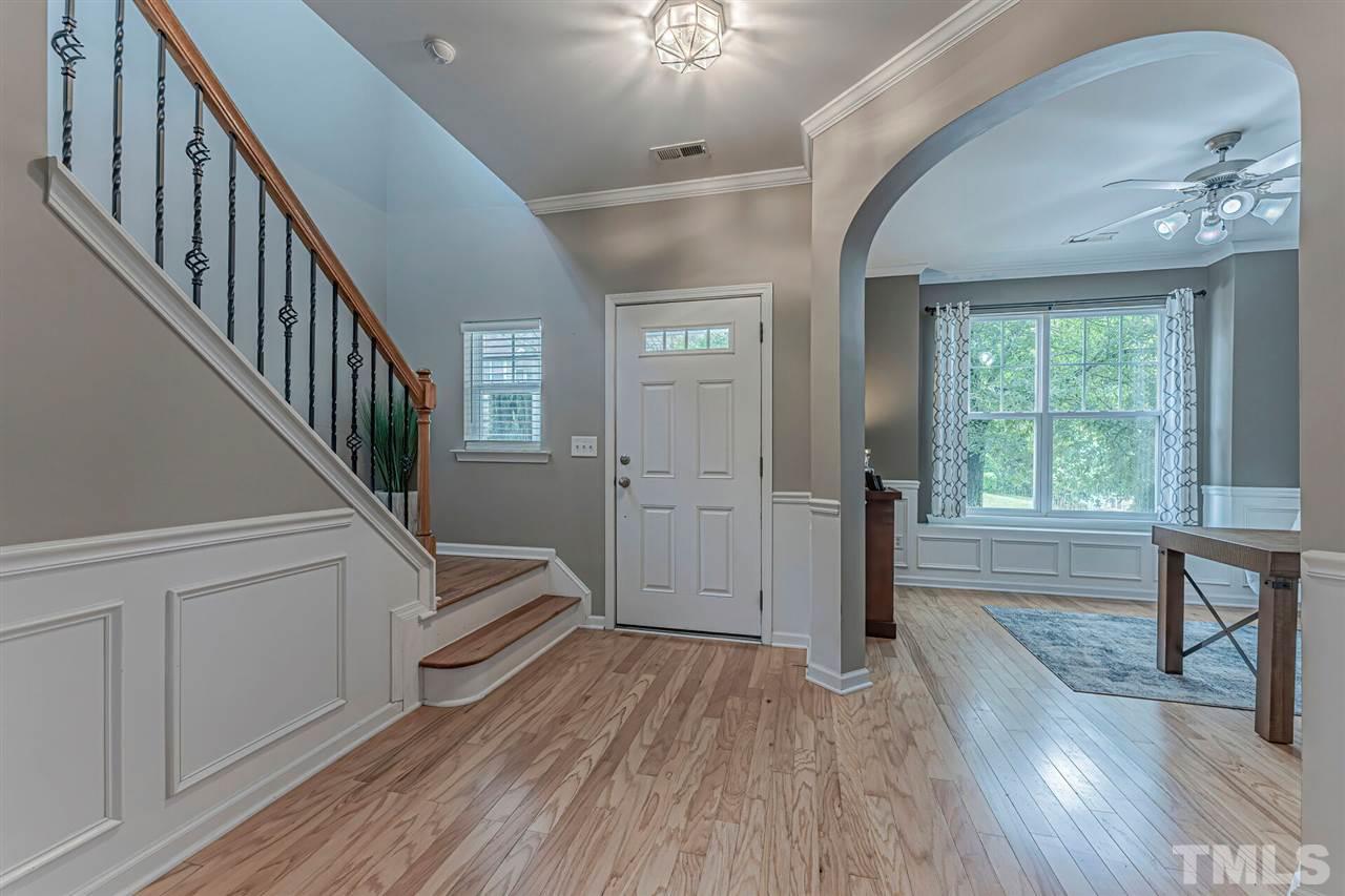 5903 Hourglass Court Raleigh, NC 27612 - Photo 2 of 29 a view of entryway and hall with wooden floor
