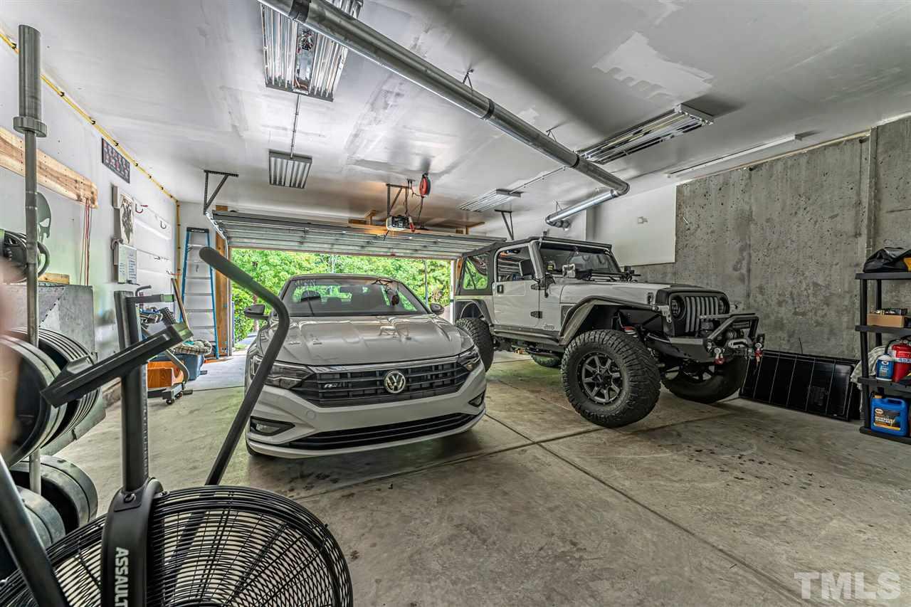 5903 Hourglass Court Raleigh, NC 27612 - Photo 28 of 29 a car parked in a garage