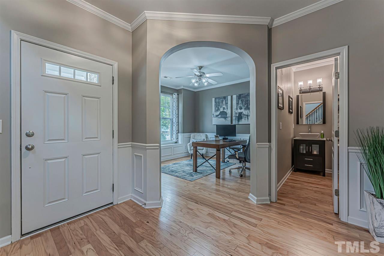 5903 Hourglass Court Raleigh, NC 27612 - Photo 4 of 29 a view of a livingroom with furniture and wooden floor