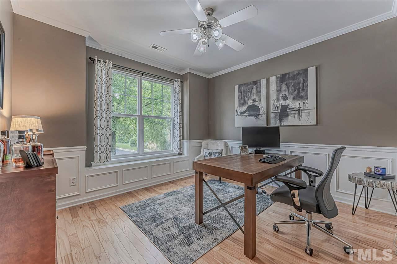 5903 Hourglass Court Raleigh, NC 27612 - Photo 5 of 29 a view of a workspace with furniture and a window