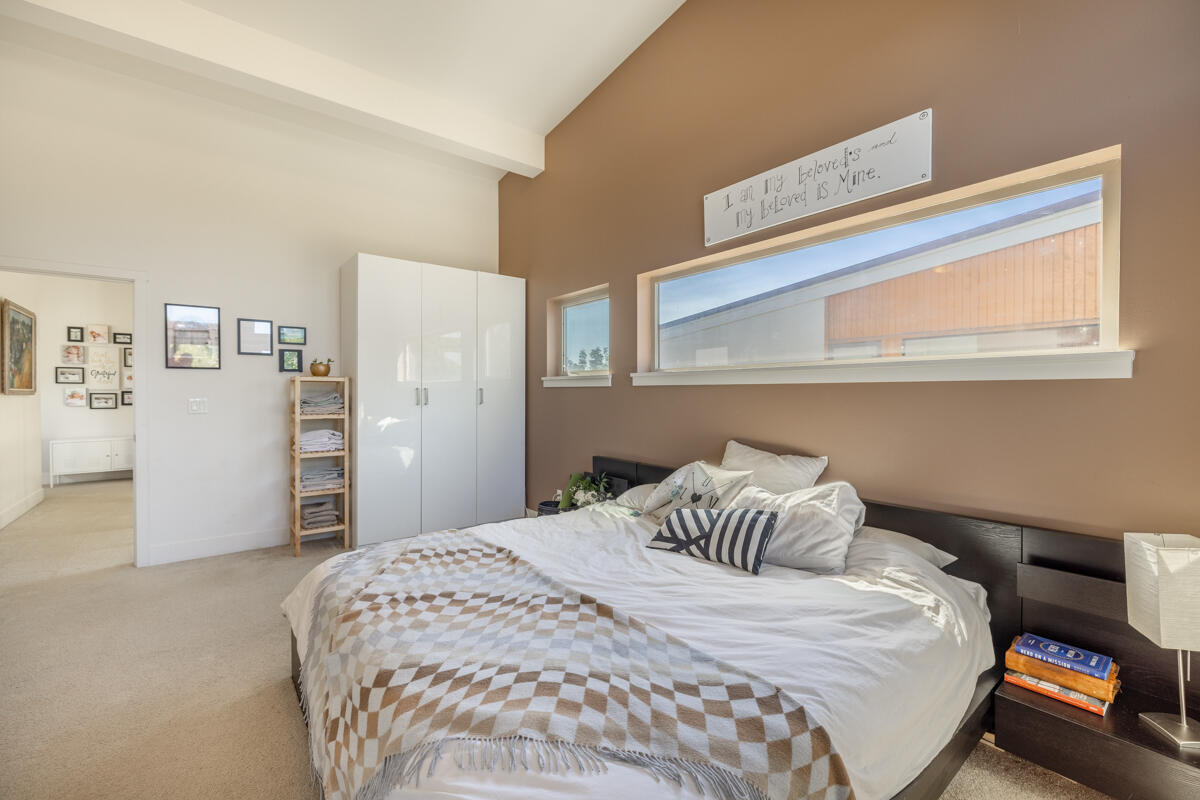 61274 Blakely Road Bend, OR 97702 - Photo 12 of 32 a bedroom with a bed and a cabinets