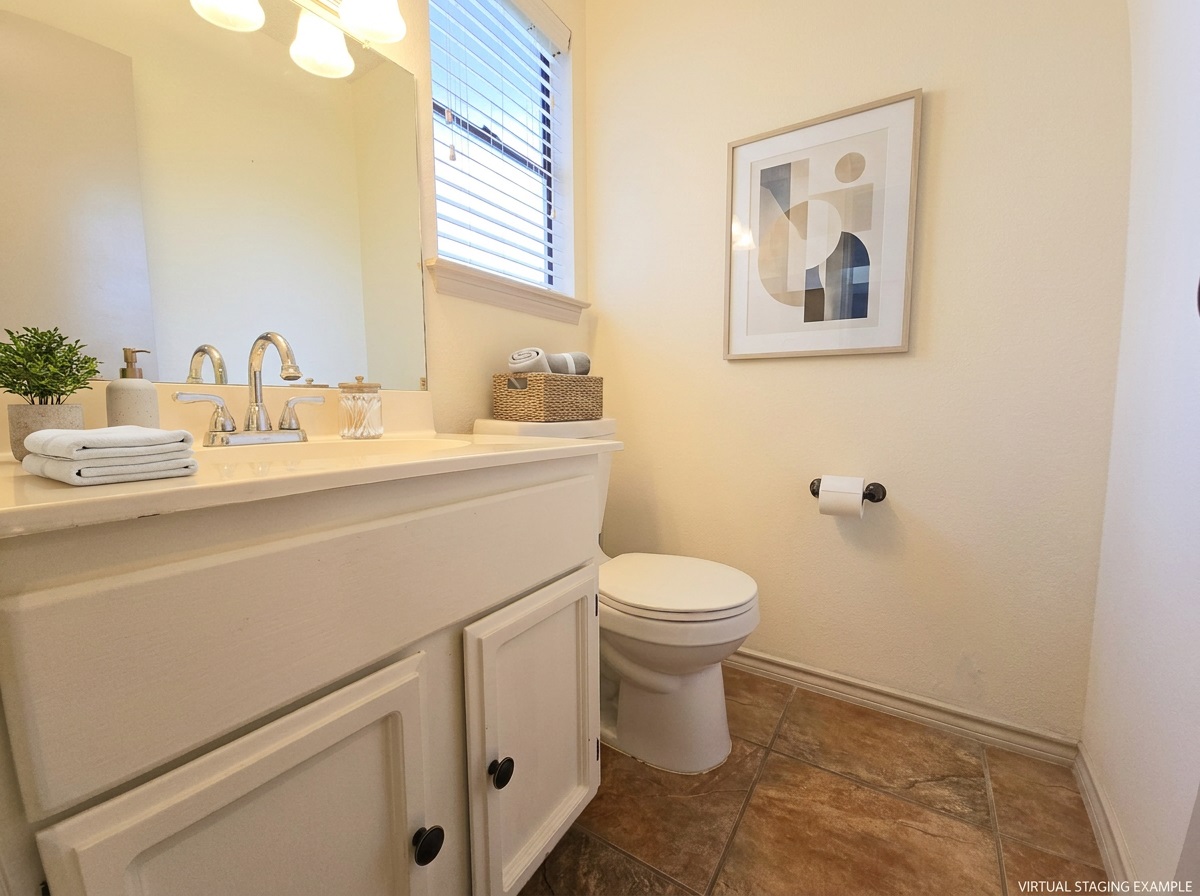 12806 Modena Trail Austin, TX 78729 - Photo 10 of 12 a bathroom with a toilet sink and mirror