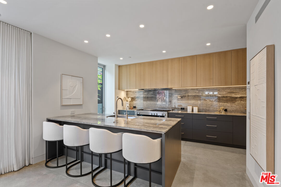 1601 Shell Avenue Venice, CA 90291 - Photo 17 of 61 a kitchen with kitchen island granite countertop a sink and stove