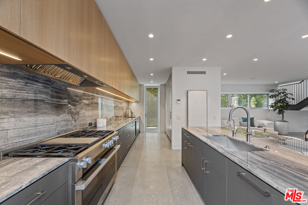 1601 Shell Avenue Venice, CA 90291 - Photo 20 of 61 a kitchen with stainless steel appliances granite countertop a sink and a stove